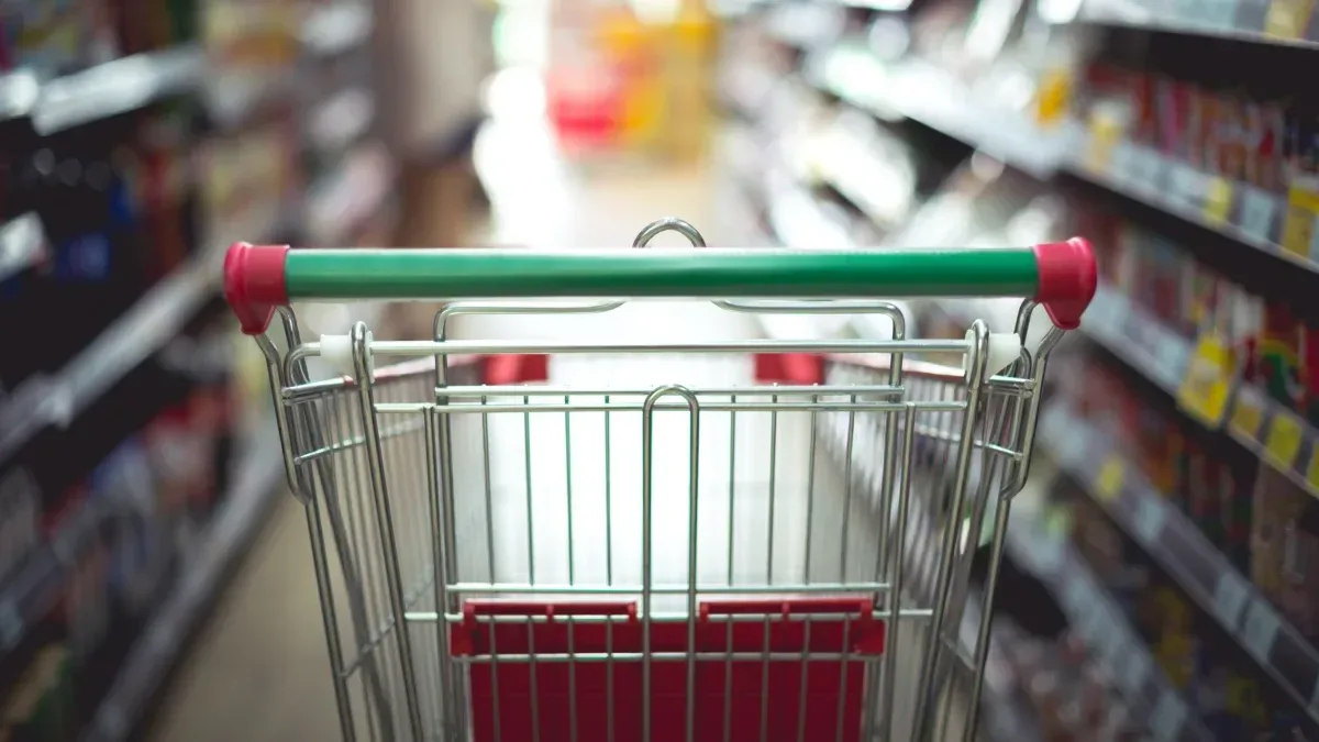 Gráfico de inflación mensual con flecha descendente y cifras del INDEC