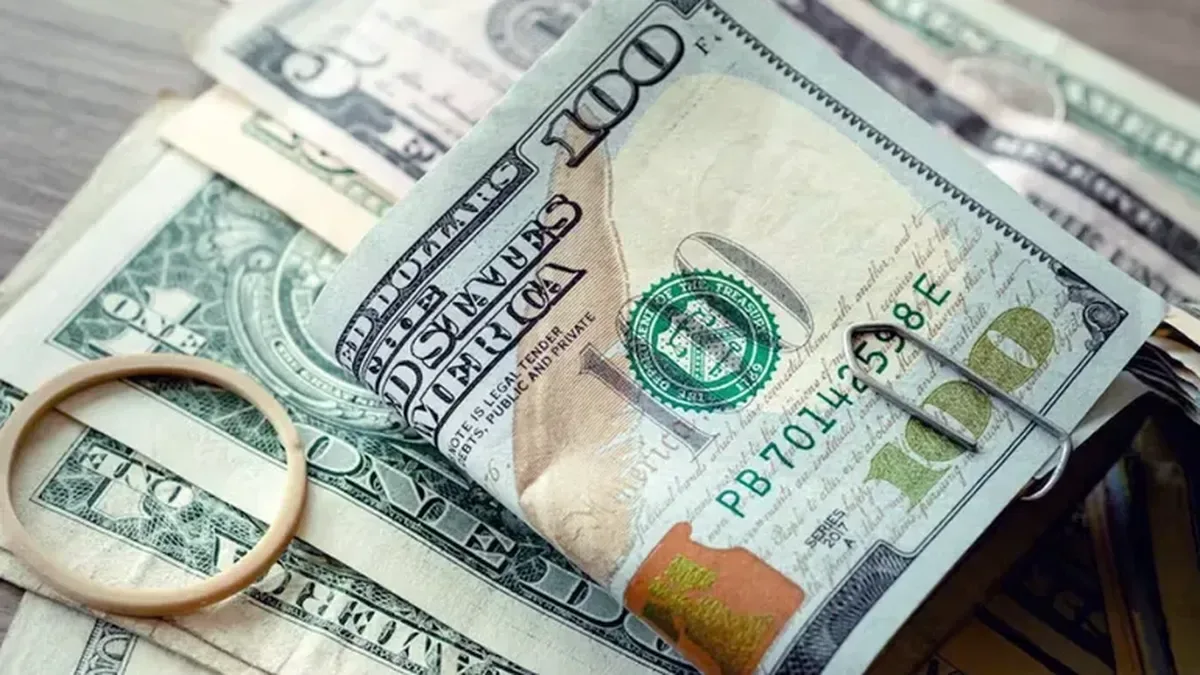 Gráfico del dólar oficial con banda cambiaria y flecha ascendente hacia $1.900